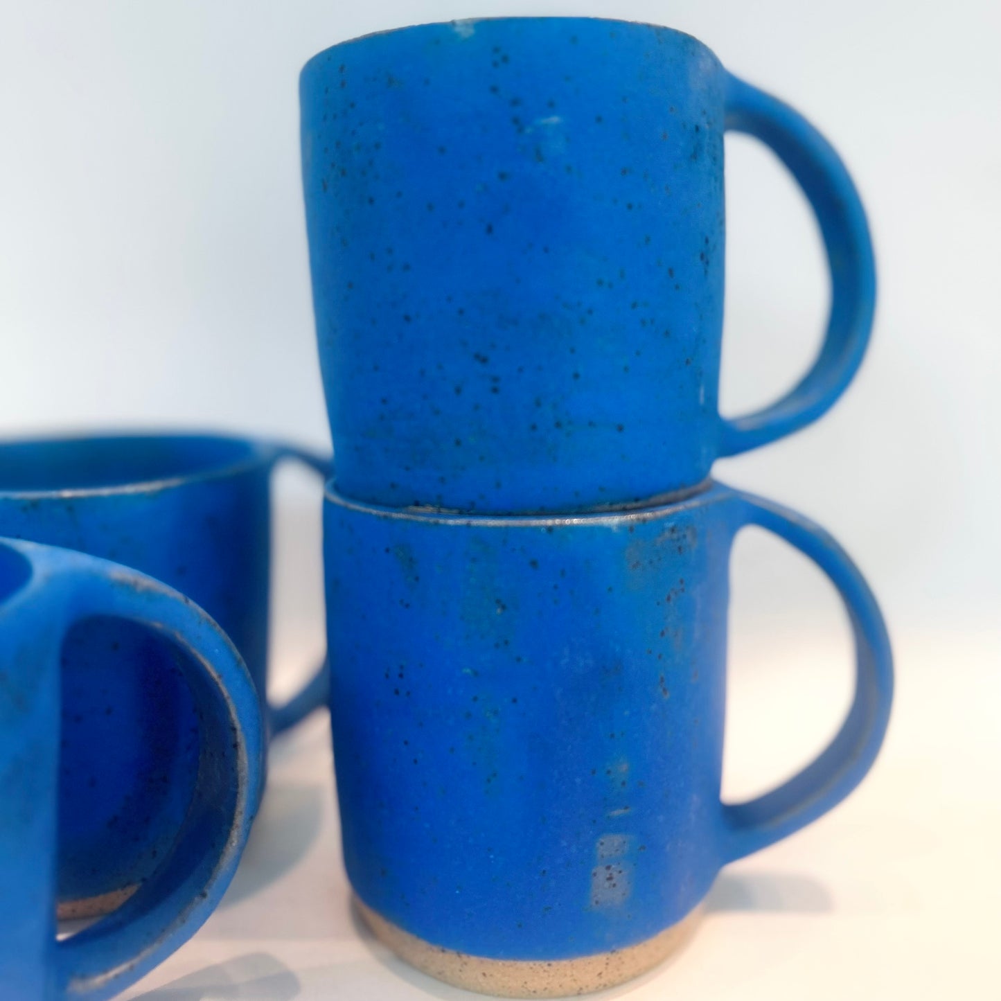 worn blue jean mugs